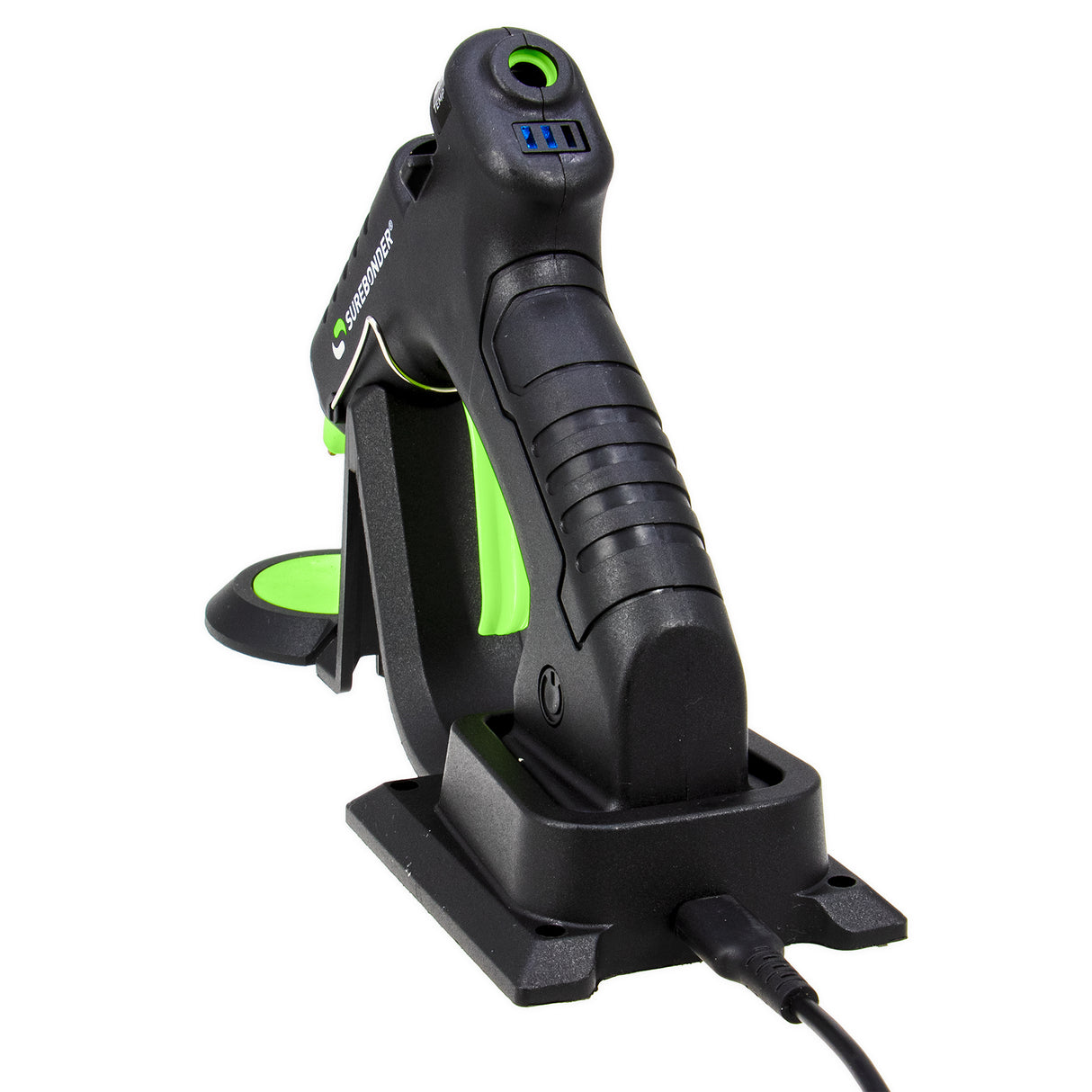 black and green glue gun sitting on charging base on white background