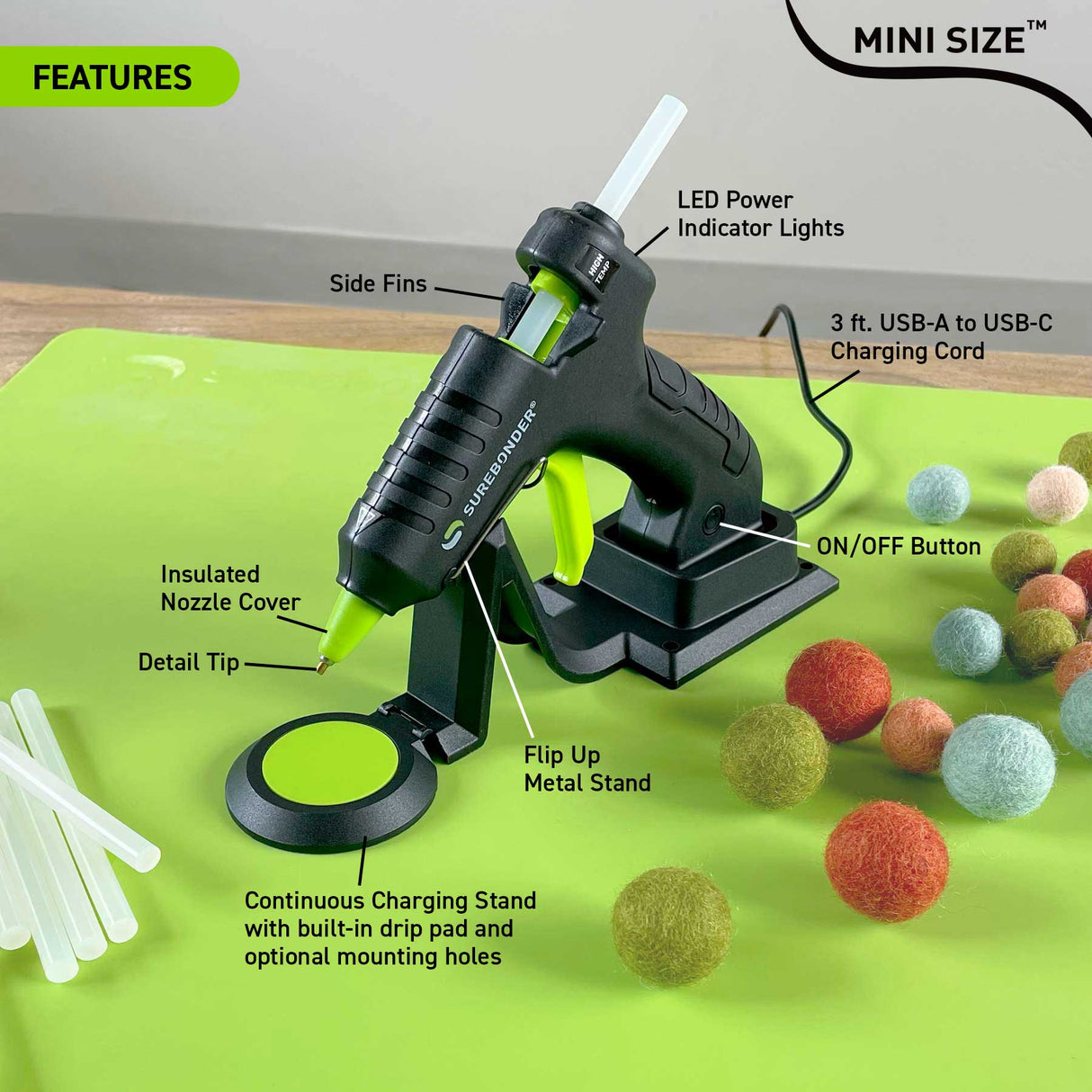 New Surebonder hot glue gun with features labeled on a green background