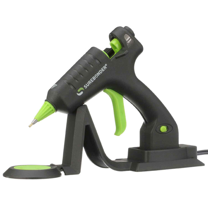 Surebonder mini-size cordless hot glue gun with precise detail tip, resting on heating stand with glue pad, 20 watts, CL-195F